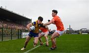19 February 2023; Ben O'Carroll of Roscommon is tackled by Aaron McKay of Armagh during the Allianz Football League Division One match between Roscommon and Armagh at Dr Hyde Park in Roscommon. Photo by Harry Murphy/Sportsfile