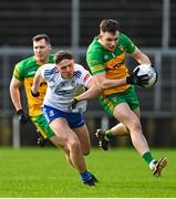 19 February 2023; Caolan McColgan of Donegal in action against Thomas McPhillips of Monaghan during the Allianz Football League Division One match between Monaghan and Donegal at St Tiernach's Park in Clones, Monaghan. Photo by Ramsey Cardy/Sportsfile