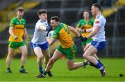 19 February 2023; Caolan McColgan of Donegal in action against Stephen O'Hanlon, left, and Killian Lavelle of Monaghan during the Allianz Football League Division One match between Monaghan and Donegal at St Tiernach's Park in Clones, Monaghan. Photo by Ramsey Cardy/Sportsfile