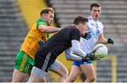 19 February 2023; Monaghan goalkeeper Rory Beggan in action against Stephen McMenamin of Donegal during the Allianz Football League Division One match between Monaghan and Donegal at St Tiernach's Park in Clones, Monaghan. Photo by Ramsey Cardy/Sportsfile