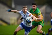 19 February 2023; Jack McCarron of Monaghan in action against Brendan McCole of Donegal during the Allianz Football League Division One match between Monaghan and Donegal at St Tiernach's Park in Clones, Monaghan. Photo by Philip Fitzpatrick/Sportsfile