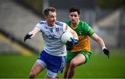 19 February 2023; Jack McCarron of Monaghan in action against Brendan McCole of Donegal during the Allianz Football League Division One match between Monaghan and Donegal at St Tiernach's Park in Clones, Monaghan. Photo by Philip Fitzpatrick/Sportsfile
