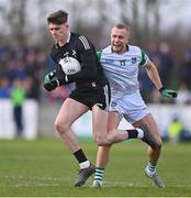 19 February 2023; Louth goalkeeper Peter McStravick is tackled by Gordon Browne of Limerick during the Allianz Football League Division Two match between Louth and Limerick at Páirc Mhuire in Ardee, Louth. Photo by Ben McShane/Sportsfile