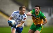 19 February 2023; Jack McCarron of Monaghan in action against Brendan McCole of Donegal during the Allianz Football League Division One match between Monaghan and Donegal at St Tiernach's Park in Clones, Monaghan. Photo by Philip Fitzpatrick/Sportsfile