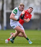 19 February 2023; Adrian Enright of Limerick is tackled by Conal McKeever of Louth during the Allianz Football League Division Two match between Louth and Limerick at Páirc Mhuire in Ardee, Louth. Photo by Ben McShane/Sportsfile