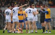 19 February 2023; Kildare and Clare players remonstrate with referee David Murnane during the Allianz Football League Division Two match between Clare and Kildare at Cusack Park in Ennis, Clare. Photo by Seb Daly/Sportsfile