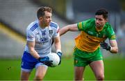 19 February 2023; Jack McCarron of Monaghan in action against Brendan McCole of Donegal during the Allianz Football League Division One match between Monaghan and Donegal at St Tiernach's Park in Clones, Monaghan. Photo by Philip Fitzpatrick/Sportsfile