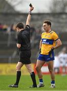 19 February 2023; Alan Sweeney of Clare is shown a black card by referee David Murnane during the Allianz Football League Division Two match between Clare and Kildare at Cusack Park in Ennis, Clare. Photo by Seb Daly/Sportsfile