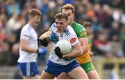 19 February 2023; Thomas McPhillips of Monaghan in action against Stephen McMenamin of Donegal during the Allianz Football League Division One match between Monaghan and Donegal at St Tiernach's Park in Clones, Monaghan. Photo by Ramsey Cardy/Sportsfile