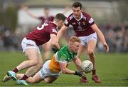 19 February 2023; Ciaran Donnelly of Offaly in action against Lorcan Dolan and Sam Duncan of Westmeath during the Allianz Football League Division Three match between Westmeath and Offaly at TEG Cusack Park in Mullingar, Westmeath. Photo by Stephen Marken/Sportsfile