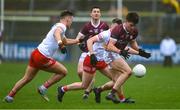 19 February 2023; Seán Kelly of Galway is tackled by Michael McKernan and Cormac Quinn of Tyrone during the Allianz Football League Division One match between Galway and Tyrone at St Jarlath's Park in Tuam, Galway. Photo by Brendan Moran/Sportsfile