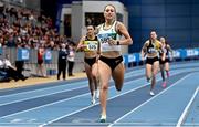 19 February 2023; Sophie Becker of Raheny Shamrock AC, crosses the line to win the senior women's 400m during day two of the 123.ie National Senior Indoor Championships at National Indoor Arena in Dublin. Photo by Sam Barnes/Sportsfile