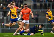 19 February 2023; Stefan Campbell of Armagh is tackled by Roscommon goalkeeper Conor Carroll during the Allianz Football League Division One match between Roscommon and Armagh at Dr Hyde Park in Roscommon. Photo by Harry Murphy/Sportsfile
