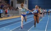 19 February 2023; Iseult O'Donnell of Raheny Shamrock AC, Dublin, left, dips for the line to win the senior women's 800m, ahead of Nadia Power of Dublin City Harriers AC, Dublin, who finished second, during day two of the 123.ie National Senior Indoor Championships at National Indoor Arena in Dublin. Photo by Sam Barnes/Sportsfile