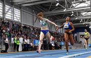 19 February 2023; Iseult O'Donnell of Raheny Shamrock AC, Dublin, left, dips for the line to win the senior women's 800m, ahead of Nadia Power of Dublin City Harriers AC, Dublin, who finished second, during day two of the 123.ie National Senior Indoor Championships at National Indoor Arena in Dublin. Photo by Sam Barnes/Sportsfile