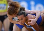 19 February 2023; Iseult O'Donnell of Raheny Shamrock AC, Dublin, left, embraces Nadia Power of Dublin City Harriers AC, Dublin, after competing in the senior women's 800m during day two of the 123.ie National Senior Indoor Championships at National Indoor Arena in Dublin. Photo by Tyler Miller/Sportsfile