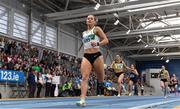 19 February 2023; Sophie Becker of Raheny Shamrock AC, Dublin, crosses the line to win the senior women's 400m during day two of the 123.ie National Senior Indoor Championships at National Indoor Arena in Dublin. Photo by Sam Barnes/Sportsfile
