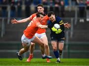19 February 2023; Roscommon goalkeeper Conor Carroll in action against Barry McCambridge of Armagh during the Allianz Football League Division One match between Roscommon and Armagh at Dr Hyde Park in Roscommon. Photo by Harry Murphy/Sportsfile