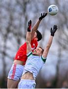 19 February 2023; Conal McCaul of Louth and Sean O'Dea of Limerick contest a high ball during the Allianz Football League Division Two match between Louth and Limerick at Páirc Mhuire in Ardee, Louth. Photo by Ben McShane/Sportsfile