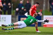 19 February 2023; Craig Lennon of Louth has a shot on goal saved by Limerick goalkeeper Donal O'Sullivan during the Allianz Football League Division Two match between Louth and Limerick at Páirc Mhuire in Ardee, Louth. Photo by Ben McShane/Sportsfile