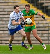 19 February 2023; Conor McManus of Monaghan in action against Jeaic McKelvey of Donegal during the Allianz Football League Division One match between Monaghan and Donegal at St Tiernach's Park in Clones, Monaghan. Photo by Ramsey Cardy/Sportsfile