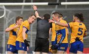 19 February 2023; Clare players remonstrate with referee David Murnane after an injury time free is awarded against their side during the Allianz Football League Division Two match between Clare and Kildare at Cusack Park in Ennis, Clare. Photo by Seb Daly/Sportsfile