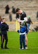 19 February 2023; Rory Beggan of Monaghan signing autographs for a young Monaghan fan during the Allianz Football League Division One match between Monaghan and Donegal at St Tiernach's Park in Clones, Monaghan. Photo by Philip Fitzpatrick/Sportsfile
