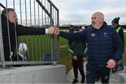 19 February 2023; Kildare manager Glenn Ryan, right, is congratulated by supporter Darren Clinton, from Gorsebridge, Kilkenny, after their side's victory in the Allianz Football League Division Two match between Clare and Kildare at Cusack Park in Ennis, Clare. Photo by Seb Daly/Sportsfile