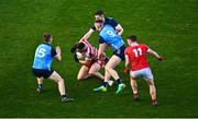 19 February 2023; Cork goalkeeper Micheál Aodh Martin is tackled by Tom Lahiff, 9, and Lee Gannon of Dublin during the Allianz Football League Division Two match between Cork and Dublin at Páirc Ui Chaoimh in Cork. Photo by Eóin Noonan/Sportsfile