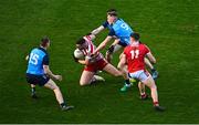 19 February 2023; Cork goalkeeper Micheál Aodh Martin is tackled by Tom Lahiff, right, and Lee Gannon of Dublin during the Allianz Football League Division Two match between Cork and Dublin at Páirc Ui Chaoimh in Cork. Photo by Eóin Noonan/Sportsfile