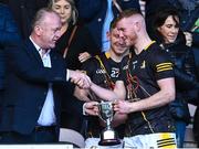 19 February 2023; Kilkenny captain Paddy Mullen is presented with the Dillion Quirke cup by Dan Quirke, father of the late Dillon Quirke, after the Dillon Quirke Foundation Hurling Challenge match between Tipperary and Kilkenny at FBD Semple Stadium in Thurles, Tipperary. Photo by Piaras Ó Mídheach/Sportsfile