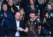 19 February 2023; Kilkenny captain Paddy Mullen is presented with the Dillion Quirke cup by Dan Quirke, father of the late Dillon Quirke, after the Dillon Quirke Foundation Hurling Challenge match between Tipperary and Kilkenny at FBD Semple Stadium in Thurles, Tipperary. Photo by Piaras Ó Mídheach/Sportsfile