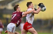 19 February 2023; Ruairí Canavan of Tyrone is tackled by Johnny McGrath of Galway during the Allianz Football League Division One match between Galway and Tyrone at St Jarlath's Park in Tuam, Galway. Photo by Brendan Moran/Sportsfile