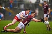 19 February 2023; John Daly of Galway is tackled by Ruairí Canavan of Tyrone during the Allianz Football League Division One match between Galway and Tyrone at St Jarlath's Park in Tuam, Galway. Photo by Brendan Moran/Sportsfile