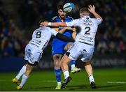 18 February 2023; Harry Byrne of Leinster kicks under pressure from Rhodri Williams and Brodie Coghlan of Dragons during the United Rugby Championship match between Leinster and Dragons at RDS Arena in Dublin. Photo by Harry Murphy/Sportsfile