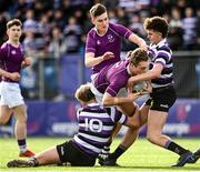20 February 2023; Callum McDonald of Clongowes Wood College is tackled by Caspar Gabriel-Lorin and Rory King of Terenure College during the Bank of Ireland Schools Senior Cup First Round replay match between Terenure College and Clongowes Wood College at Energia Park in Dublin. Photo by Harry Murphy/Sportsfile