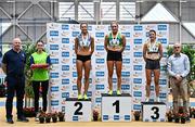 19 February 2023; Senior women's 1500m medallists, Carla Sweeney of Rathfarnham WSAF AC, Dublin, gold, Amy O Donoghue of Dundrum South Dublin AC, Dublin, silver, and Ellie Hartnett of UCD AC, Dublin, bronze, alongside Athletics Ireland Chief Executive Officer Hamish Adams, left, and 123.ie Chief Executive Officer Kevin Thompson during day two of the 123.ie National Senior Indoor Championships at National Indoor Arena in Dublin. Photo by Sam Barnes/Sportsfile