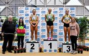 19 February 2023; Senior women's 60m medallists, Sarah Leahy of Killarney Valley AC, Kerry, gold, Joan Healy of Leevale AC, Cork, silver, and Lucy-May Sleeman of Leevale AC, Cork, bronze,  alongside Athletics Ireland President John Cronin and Olympian Derval O'Rourke during day two of the 123.ie National Senior Indoor Championships at National Indoor Arena in Dublin. Photo by Sam Barnes/Sportsfile