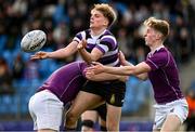20 February 2023; Caspar Gabriel-Lorin of Terenure College is tackled by Harry Roche-Nagle and Harry Mallon of Clongowes Wood College  during the Bank of Ireland Schools Senior Cup First Round replay match between Terenure College and Clongowes Wood College at Energia Park in Dublin. Photo by Harry Murphy/Sportsfile