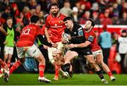 17 February 2023; Reuben Morgan-Williams of Ospreys is tackled by Paddy Patterson, right, and Joey Carbery of Munster during the United Rugby Championship match between Munster and Ospreys at Thomond Park in Limerick. Photo by Sam Barnes/Sportsfile