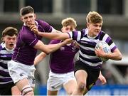 20 February 2023; Caspar Gabriel-Lorin of Terenure College evades the tackle of Blayze Molloy of Clongowes Wood College on his way to scoring his side's second try during the Bank of Ireland Schools Senior Cup First Round replay match between Terenure College and Clongowes Wood College at Energia Park in Dublin. Photo by Harry Murphy/Sportsfile