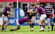20 February 2023; Harvey O'Leary of Terenure College is tackled by Dan Daly and Harry Mallon of Clongowes Wood College during the Bank of Ireland Schools Senior Cup First Round replay match between Terenure College and Clongowes Wood College at Energia Park in Dublin. Photo by Harry Murphy/Sportsfile