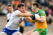 19 February 2023; Jamie Brennan of Donegal in action against Darren Hughes of Monaghan during the Allianz Football League Division One match between Monaghan and Donegal at St Tiernach's Park in Clones, Monaghan. Photo by Ramsey Cardy/Sportsfile