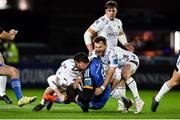 18 February 2023; Max Deegan of Leinster is tackled by Jack Dixon, left, and Steff Hughes of Dragons during the United Rugby Championship match between Leinster and Dragons at RDS Arena in Dublin. Photo by Tyler Miller/Sportsfile