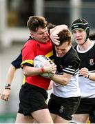 20 February 2023; Danny Killeen of CBC Monkstown is tackled by Tadhg Brophy of Newbridge College during the Bank of Ireland Leinster Rugby Schools Senior Cup Quarter Final match between CBC Monkstown and Newbridge College at Energia Park in Dublin. Photo by Harry Murphy/Sportsfile
