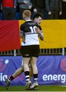 20 February 2023; Ruairi Munnelly of Newbridge College celebrates with teammate Paddy Martin after scoring his side's fifth try  during the Bank of Ireland Leinster Rugby Schools Senior Cup Quarter Final match between CBC Monkstown and Newbridge College at Energia Park in Dublin. Photo by Harry Murphy/Sportsfile