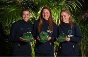 21 February 2023; Players, from left, Abbie Larkin, Kyra Carusa and Izzy Atkinson poses with their Republic of Ireland 2022-2023 caps during a presentation at the team hotel in Marbella, Spain. Photo by Stephen McCarthy/Sportsfile