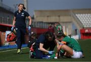 22 February 2023; Republic of Ireland team doctor Siobhan Forman, left, runs on to assist physiotherapist Angela Kenneally in giving medical attention to Katie McCabe of Republic of Ireland during the international friendly match between China PR and Republic of Ireland at Estadio Nuevo Mirador in Algeciras, Spain. Photo by Stephen McCarthy/Sportsfile