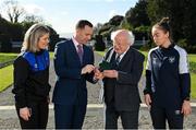 23 February 2023; The President of Ireland Michael D Higgins is presented with a commemorative medal from League of Ireland director Mark Scanlon, and the team captains of the FAI Women's President's Cup, Laurie Ryan of Athlone Town, left, and Pearl Slattery of Shelbourne, at Áras an Uachtaráin in the Phoenix Park, Dublin. Photo by Seb Daly/Sportsfile