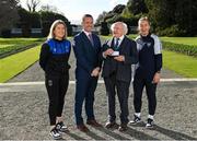 23 February 2023; The President of Ireland Michael D Higgins is presented with a commemorative medal from League of Ireland director Mark Scanlon, and the team captains of the FAI Women's President's Cup, Laurie Ryan of Athlone Town, left, and Pearl Slattery of Shelbourne, at Áras an Uachtaráin in the Phoenix Park, Dublin. Photo by Seb Daly/Sportsfile